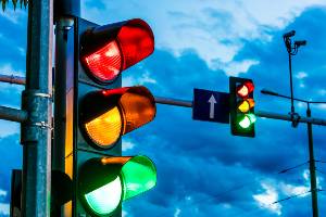 traffic lights in front of overcast sky