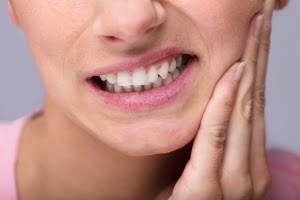 woman with aching jaw