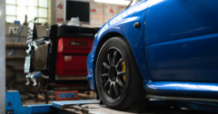 blue car in auto repair shop