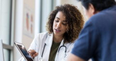 female doctor showing images to patient