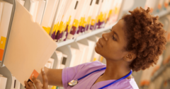 nurse looking at medical records