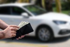 man taking cash out of wallet