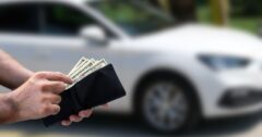 man taking cash out of wallet