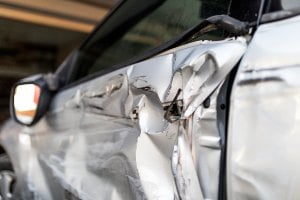 wrecked silver car 