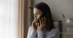 woman at home talkin on phone