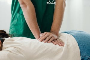 doctor working on someone's back