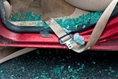 car seat belt in smashed glass