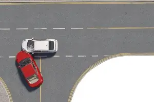 computerized image of a red car T-boning a white car in an intersection